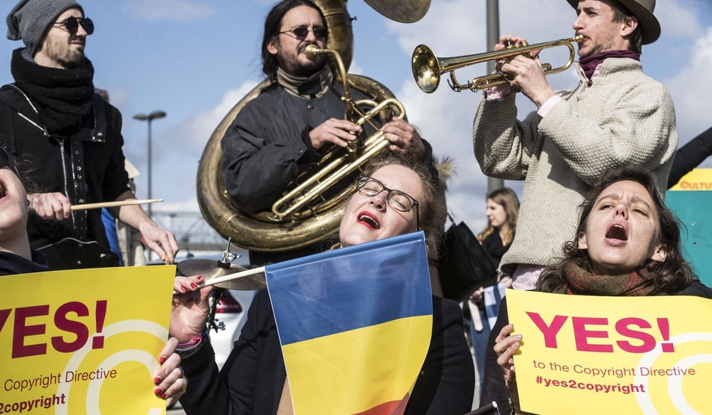 People gather at the front of the European Parliament building in Strasbourg, France, to show their support for the copyright bill. Photo: AP Photo