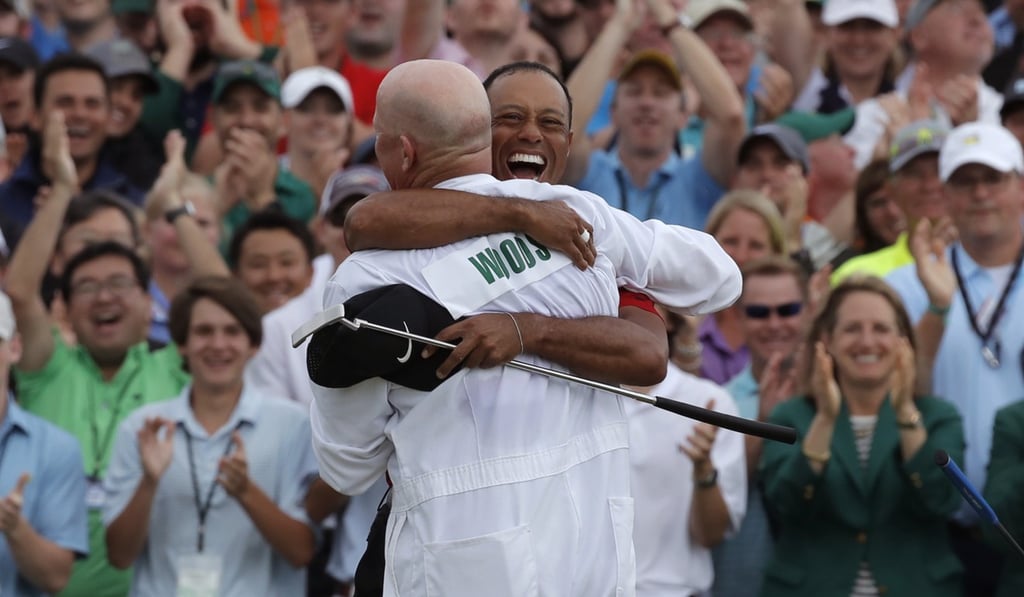 Tiger Woods celebrates with caddie Joe LaCava. Photo: Reuters