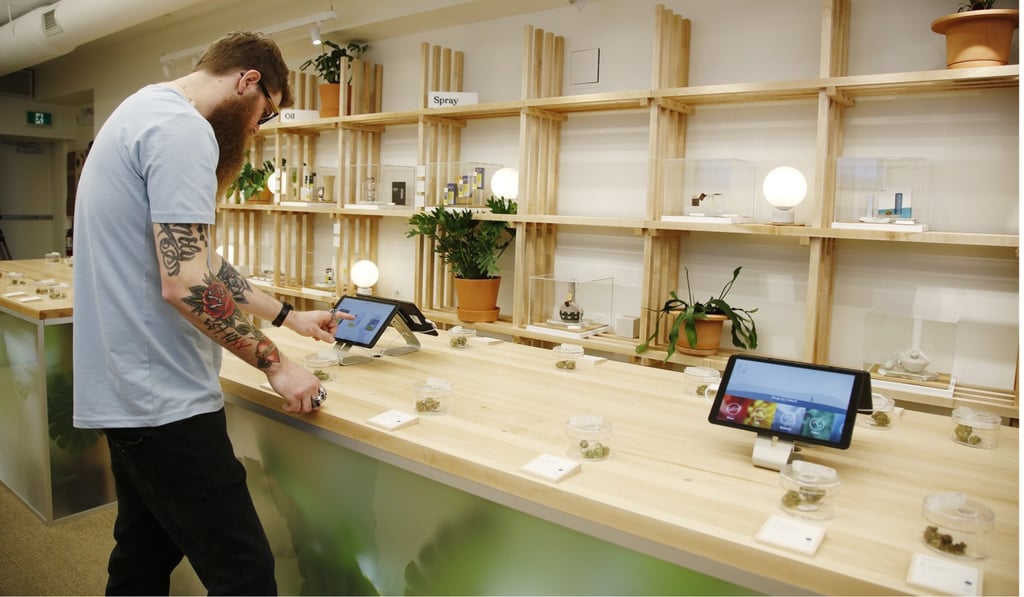 An employee uses a tablet computer to search for products at the HOBO Recreational Cannabis Store in Ottawa on Monday, April 1, 2019. Photo: Bloomberg