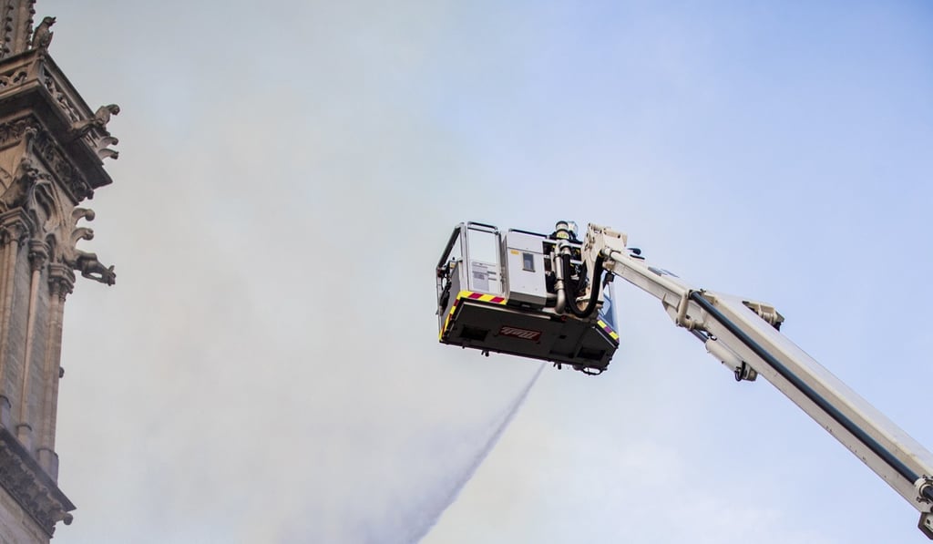 Fire fighters working at the burning Notre Dame cathedral, Monday April 15. Photo: BSPP via AP