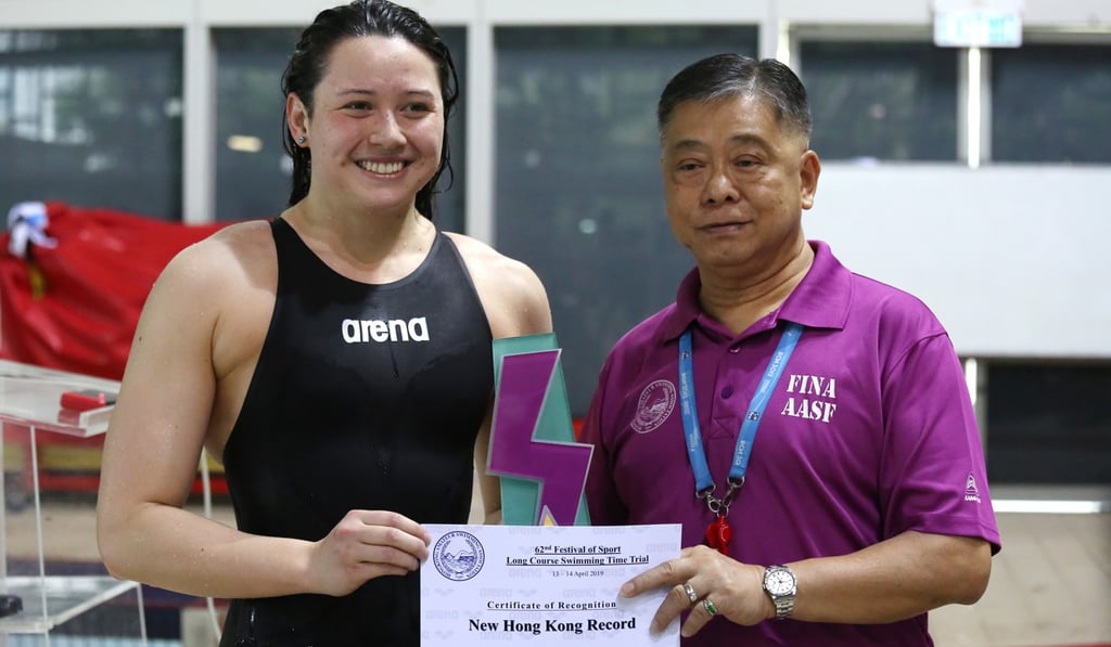 Siobhan Haughey receives a certificate for setting a new national record, as she qualifies for the Tokyo Olympic Games. Photo: Jonathan Wong