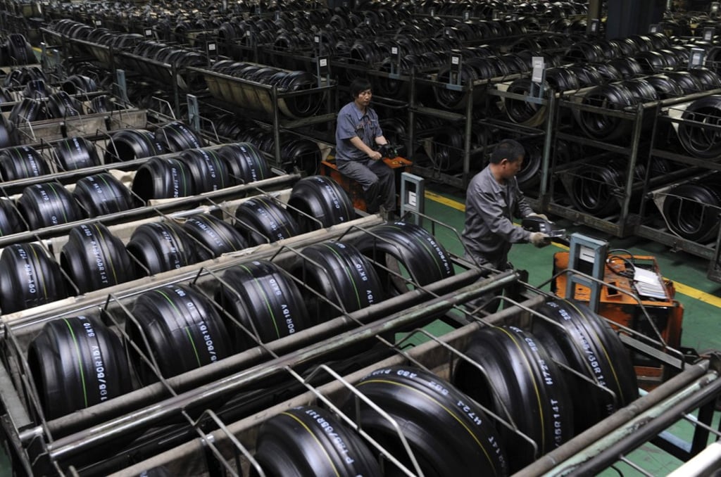 Employees transport tires at a Hankook Tyre factory in Jiaxing, Zhejiang province. Makers of tyres and other automotive industry parts are waiting anxiously for US President Donald Trump to decide if he will roll out tariffs on the global car industry. Photo: Reuters