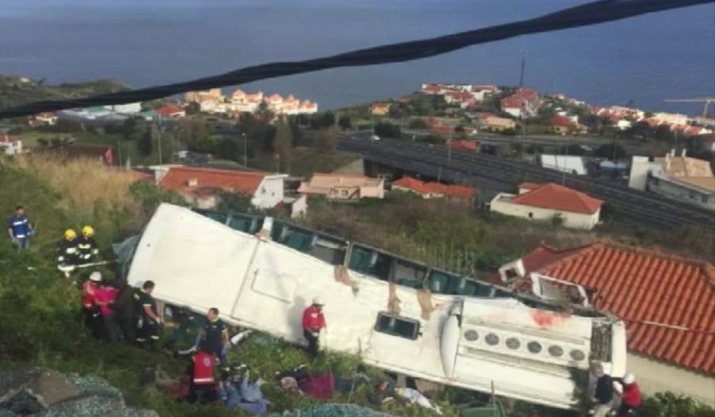 A video screen grab shows emergency personnel at the scene after a tour bus crashed at Canico on Portugal’s Madeira Island on Wednesday. Photo: AP/TVI A video screen grab shows emergency personnel at the scene after a tour bus crashed at Canico on Portugal’s Madeira Island on Wednesday. Photo: AP/TVI