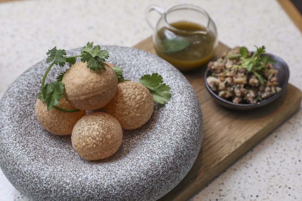 Pani puri with potatoes and spicy tangy water. Photo: K.Y. Cheng