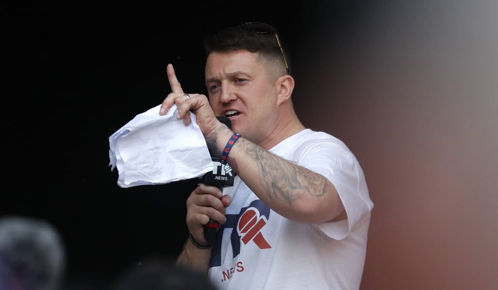 British far-right activist Tommy Robinson speaks during a rally in Parliament Square after the final leg of the “March to Leave” in London. Photo: AP Photo British far-right activist Tommy Robinson speaks during a rally in Parliament Square after the final leg of the “March to Leave” in London. Photo: AP Photo