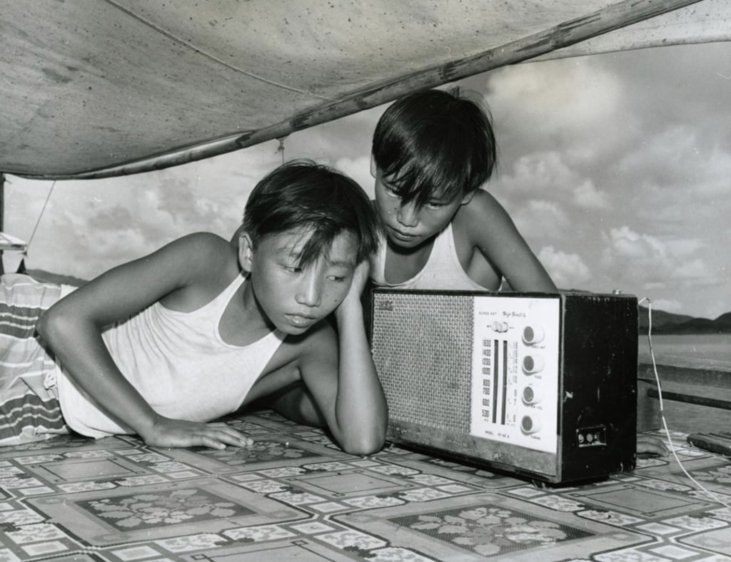 Children listen to storytelling broadcasts on the radio, in 1969. Photo: Public Records Office