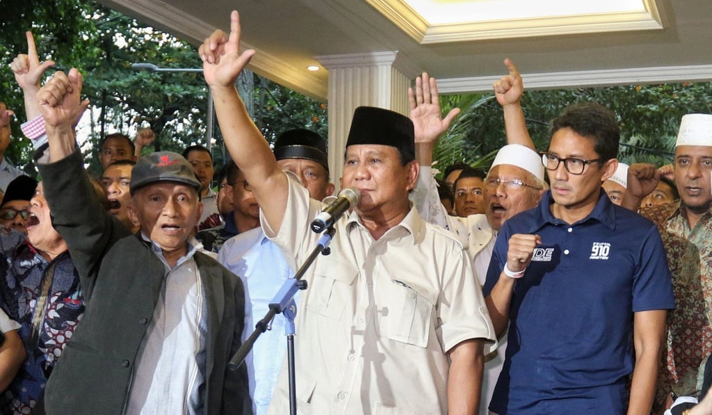 Prabowo, centre, and his running mate have also declared victory. Photo: AFP
