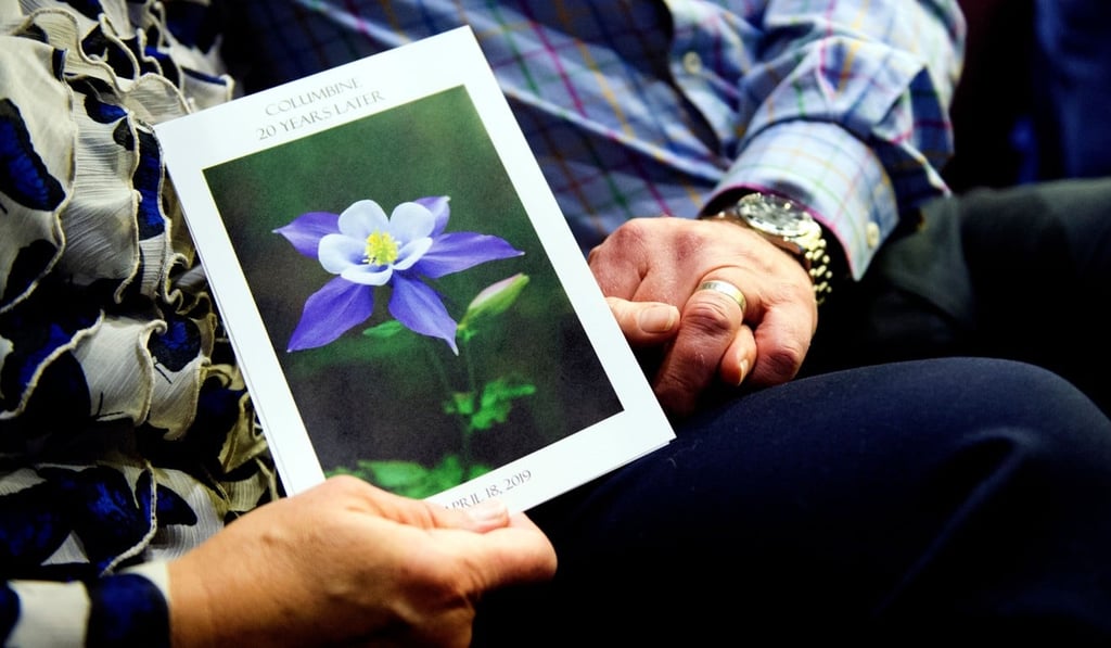 A couple holds hands during “Columbine 20 Years Later: A Faith-based Remembrance Service” for the victims of the Columbine High School shooting at Waterstone Community Church in Littleton, Colorado, on April 18. Photo: AFP