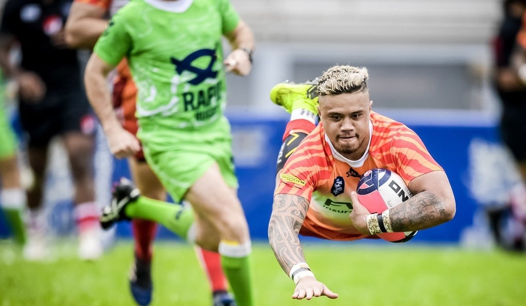 Tigers full back Nathan De Thierry dives in for a try in the first Global Rapid Rugby game in Hong Kong. Photo: HKRU