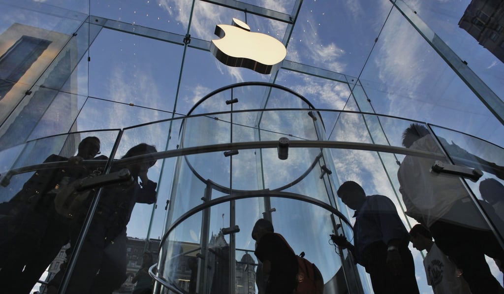 Customers visit the Apple shop in New York. Photo: Reuters