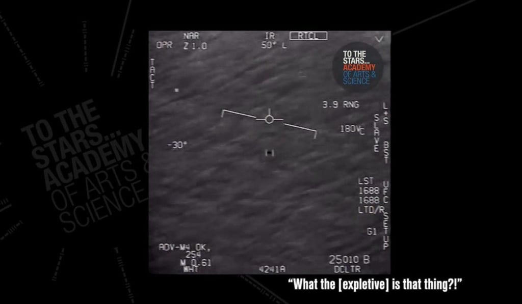 A still image taken from a US Navy video appears to show a UFO skimming low over the ocean. The video was said to have been shot off the US East Coast in 2015. Photo: TTSA / US Navy