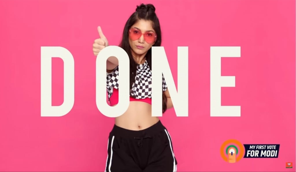 Young dancers in neon-coloured trainers and baseball caps remind viewers to vote for Modi in a BJP music video. Source: YouTube
