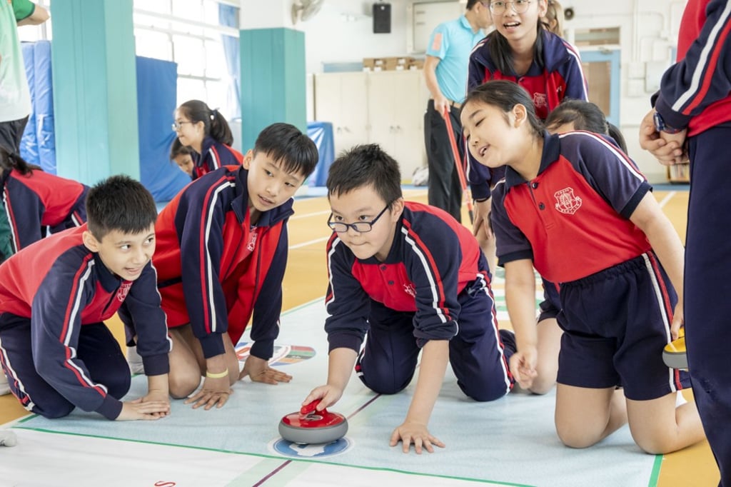 Students from the Canton Road Government Primary School are a picture of concentration during a game of FloorCurling.