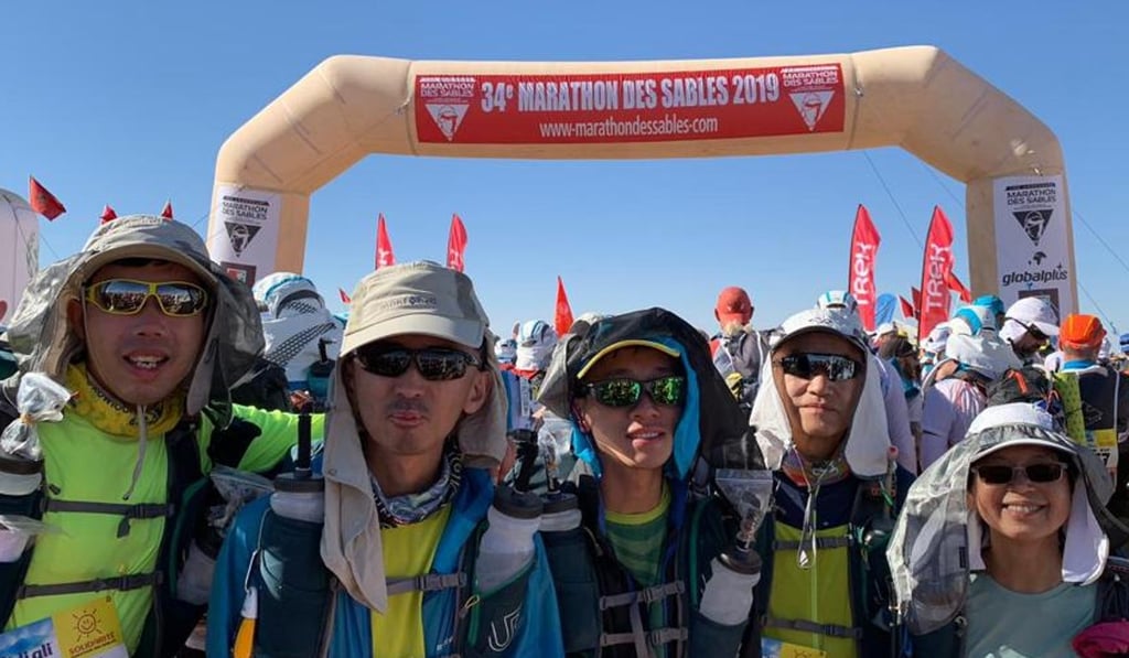 (From left) Lam Pok-yin, Wu Man-hang and Leung Hok-hin with their psychologist (right) Rachel Poon prepare to run the 250km multi-day race.