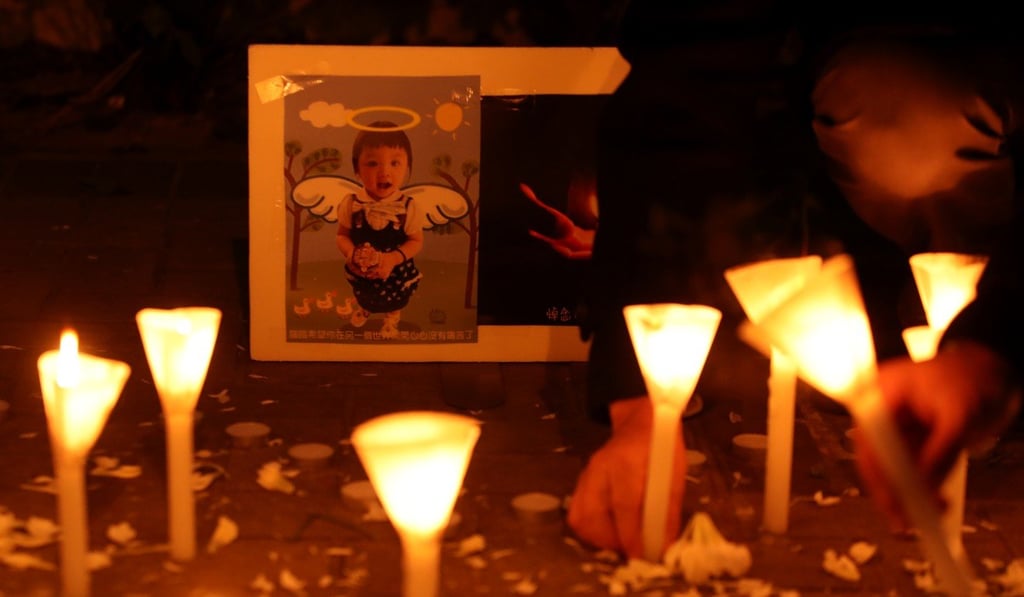 Mourners take part in a candlelight vigil in Tamar, Admiralty, for five-year-old Chan Sui-lam who died in January 2018 in Tamar, Central. Her father and stepmother were arrested in connection with her death. Photo: Handout