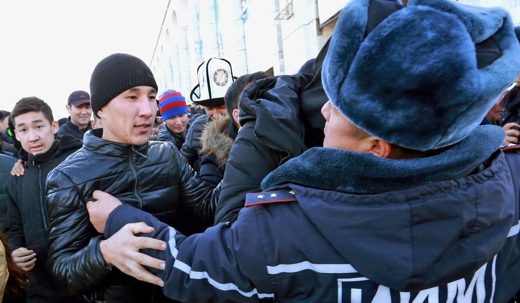 A Kyrgyz security official scuffles with a protester at a demonstration in Bishkek, Kyrgyzstan, against the government’s policies on Chinese workers. Photo: EPA