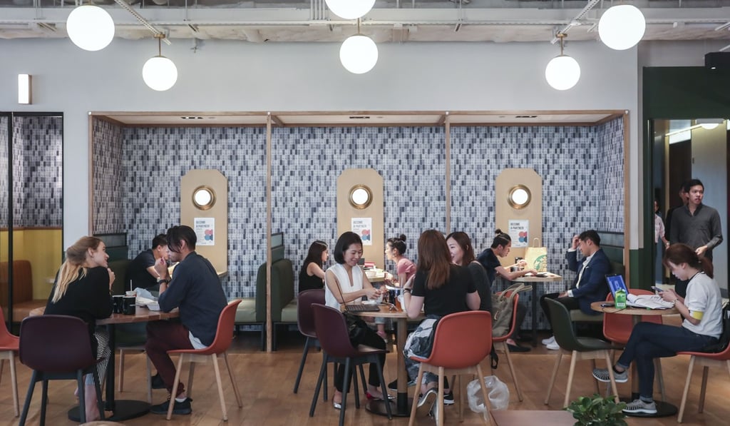People meet at WeWork, a shared office space, in Causeway Bay in June 2018. The world’s leading co-working space operator has pulled out of at least five negotiations for new space in Hong Kong. Photo: Jonathan Wong
