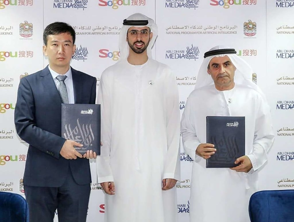 Wang Yanfeng, general manager of Sogou's Voice Interaction Technology Centre (left), United Arab Emirates minister of artificial intelligence Omar Sultan Al Olama (centre) and Ali Bin Tamim, director general of Abu Dhabi Media, at the signing ceremony at ADM’s headquarters. Photo: Handout Wang Yanfeng, general manager of Sogou's Voice Interaction Technology Centre (left), United Arab Emirates minister of artificial intelligence Omar Sultan Al Olama (centre) and Ali Bin Tamim, director general of Abu Dhabi Media, at the signing ceremony at ADM’s headquarters. Photo: Handout