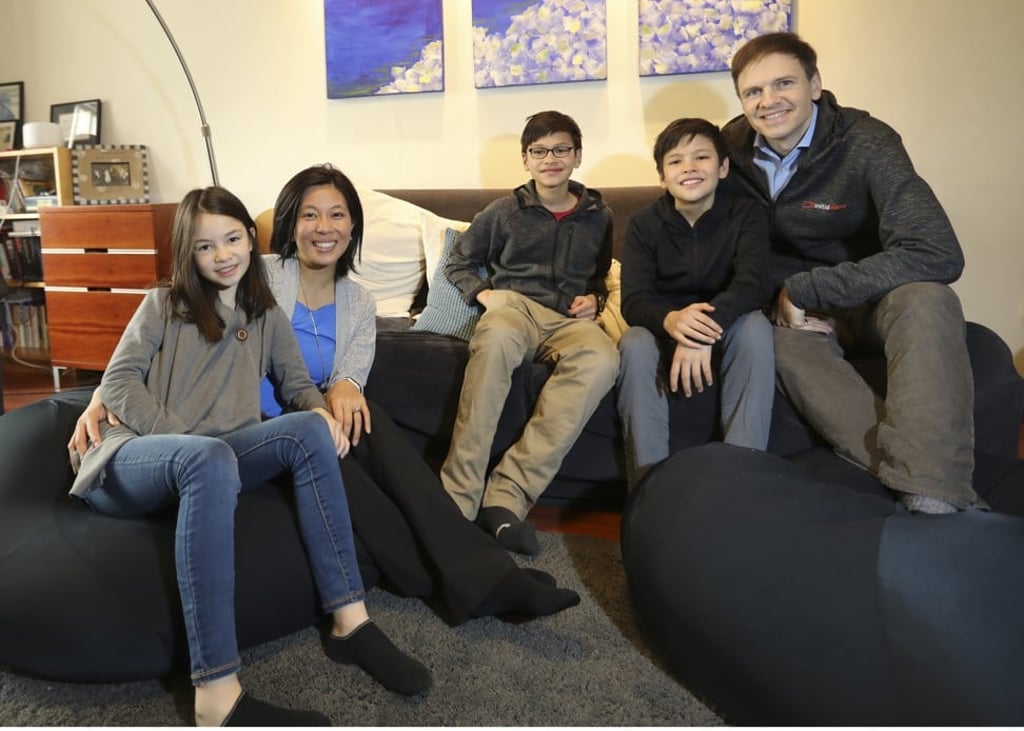 Gloria (second left) and Terry Crawford (far right) with their three children, Mia (left), Trey (centre) and Sean (second right), at their home in Beijing. Photo: Simon Song