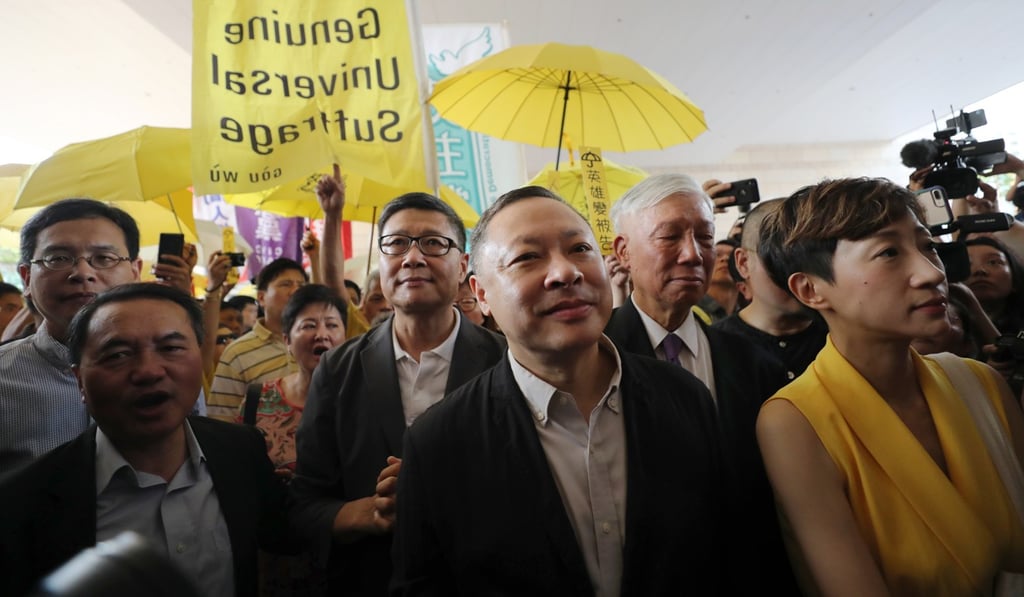 Benny Tai (second right) was one of four Occupy leaders jailed. Photo: Sam Tsang