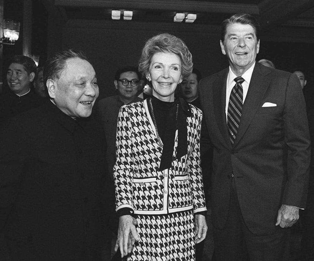 Deng Xiaoping holding hands with Nancy Reagan, and Ronald Reagan, in Beijing, in 1984. Photo: AP