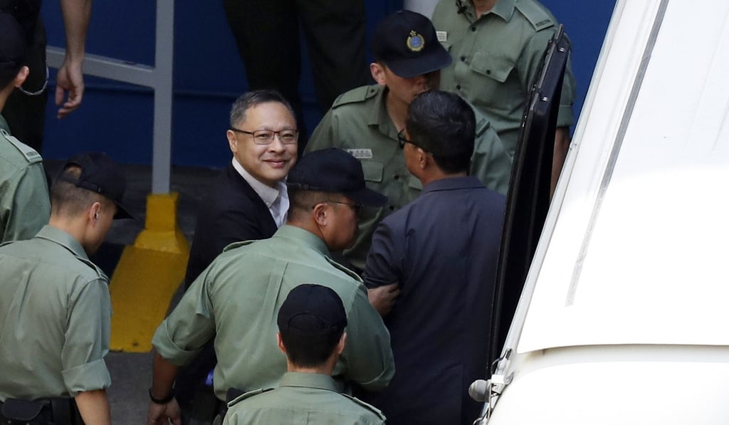 Benny Tai being escorted to the Lai Chi Kok Reception Centre. Photo: Robert Ng