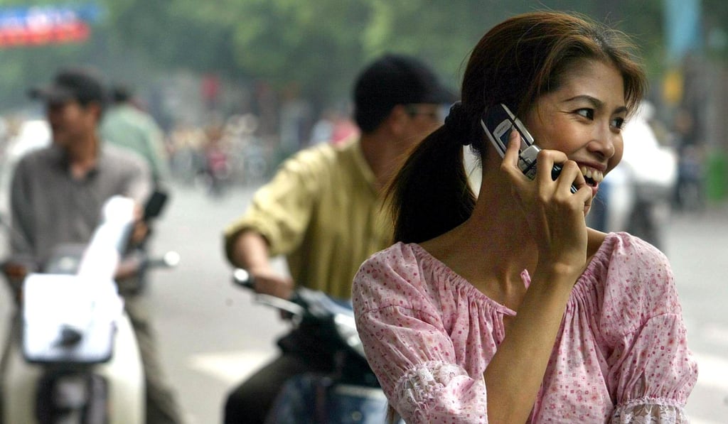 A woman talks on her mobile phone in Hanoi. Photo: AFP