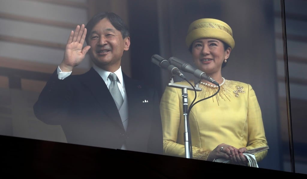 Emperor Naruhito and Empress Masako greet well-wishers on Saturday. Photo: Reuters