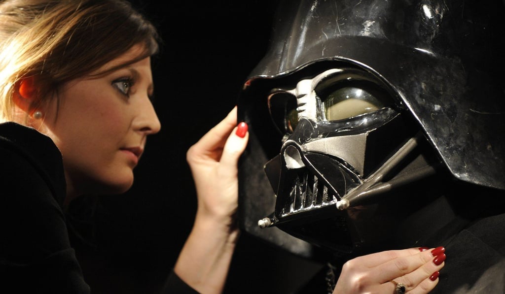 A Christie’s employee with a different Darth Vader costume in London in 2010. Photo: AP