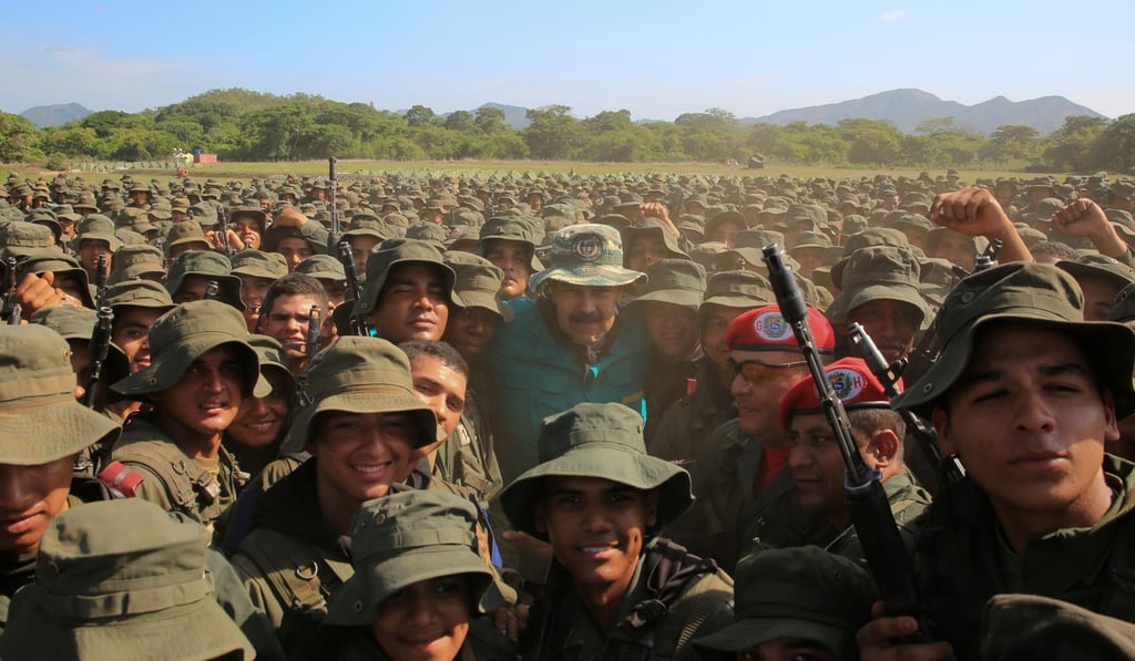 Venezuela's President Nicolas Maduro poses for a photo with soldiers during his visit to a military training center in El Pao. Photo: Handout via Reuters