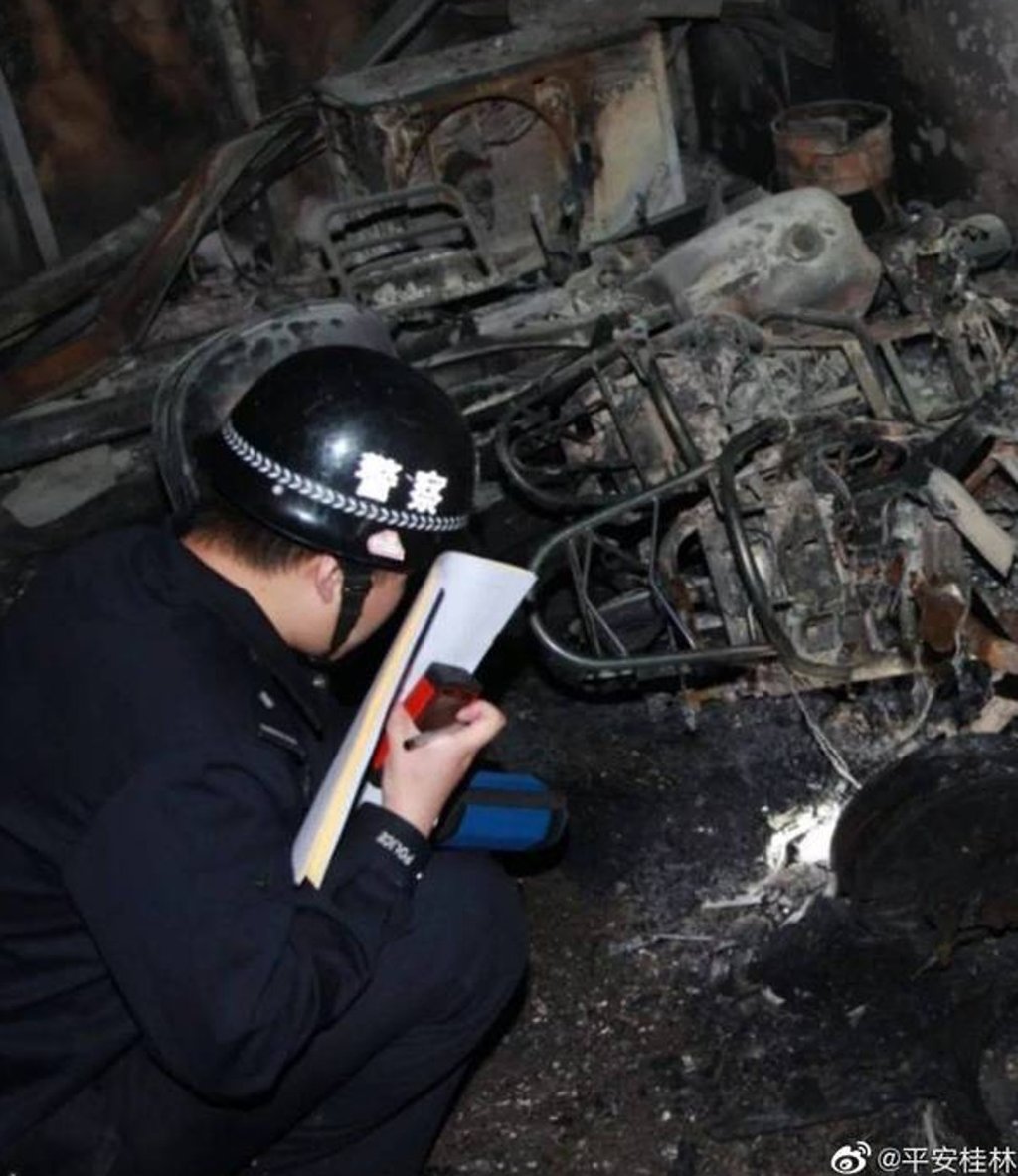 Fire and rescue teams suspect the fatal blaze started in a ground floor parking space where electric scooters were kept. Photo: Weibo Fire and rescue teams suspect the fatal blaze started in a ground floor parking space where electric scooters were kept. Photo: Weibo