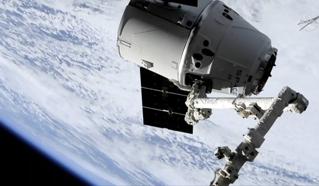 The Dragon capsule at the space station. Photo: AP