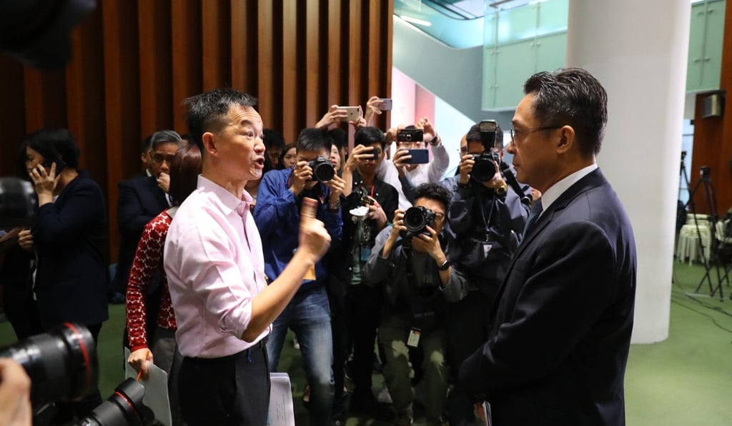 Pan-democrat lawmaker Raymond Chan confronts Kenneth Chen at the Legco building. Photo: Edmond So