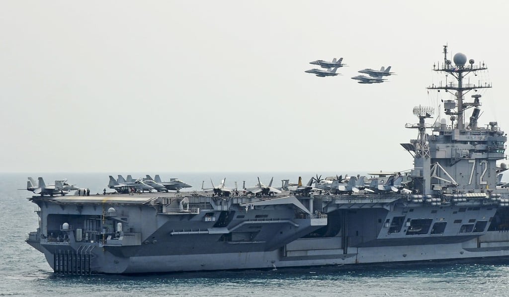 Aircraft fly in formation above the USS Abraham Lincoln aircraft carrier in a photo made available in 2012. Photo: EPA Aircraft fly in formation above the USS Abraham Lincoln aircraft carrier in a photo made available in 2012. Photo: EPA