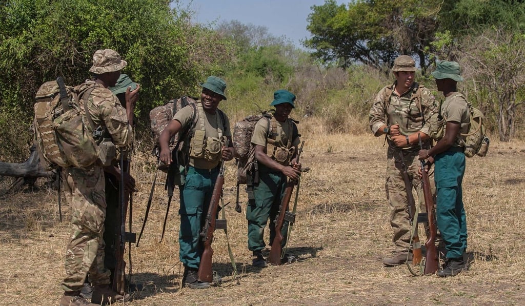 British soldiers interact with participants on an anti-poaching operation in 2017. Photo: AFP