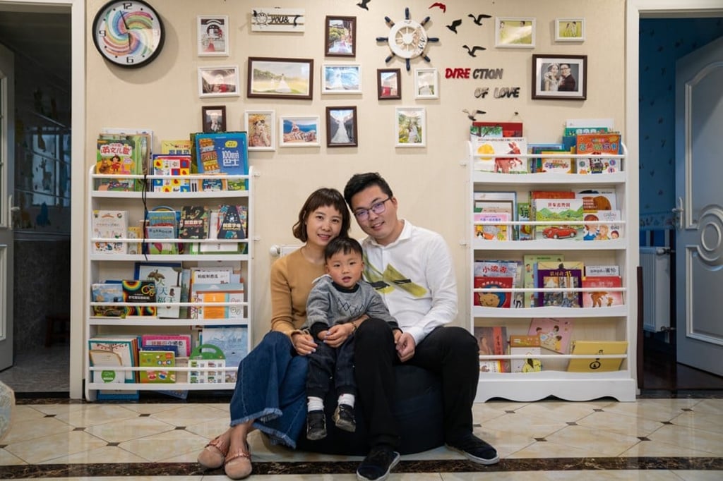 Zhou Jing with her husband, Xiao Yi, and their son, Xiao Kaixi, at home in Wuhan. Photo: Yan Cong / The Washington Post