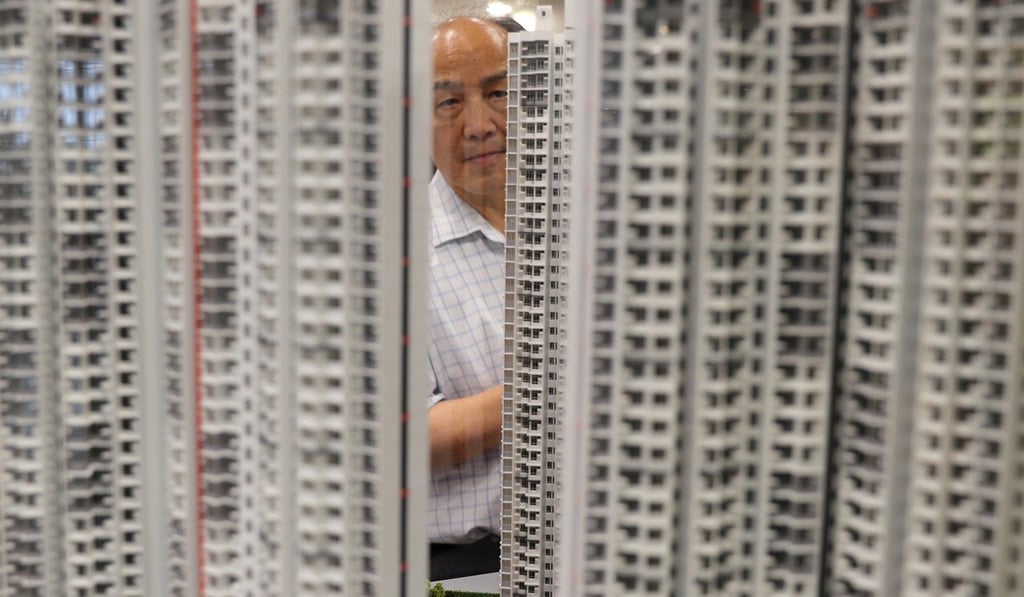 Prospective applicants for the sale of Home Ownership Scheme flats view housing models at the Lok Fu Housing Authority office in 2018. Photo: Edward Wong