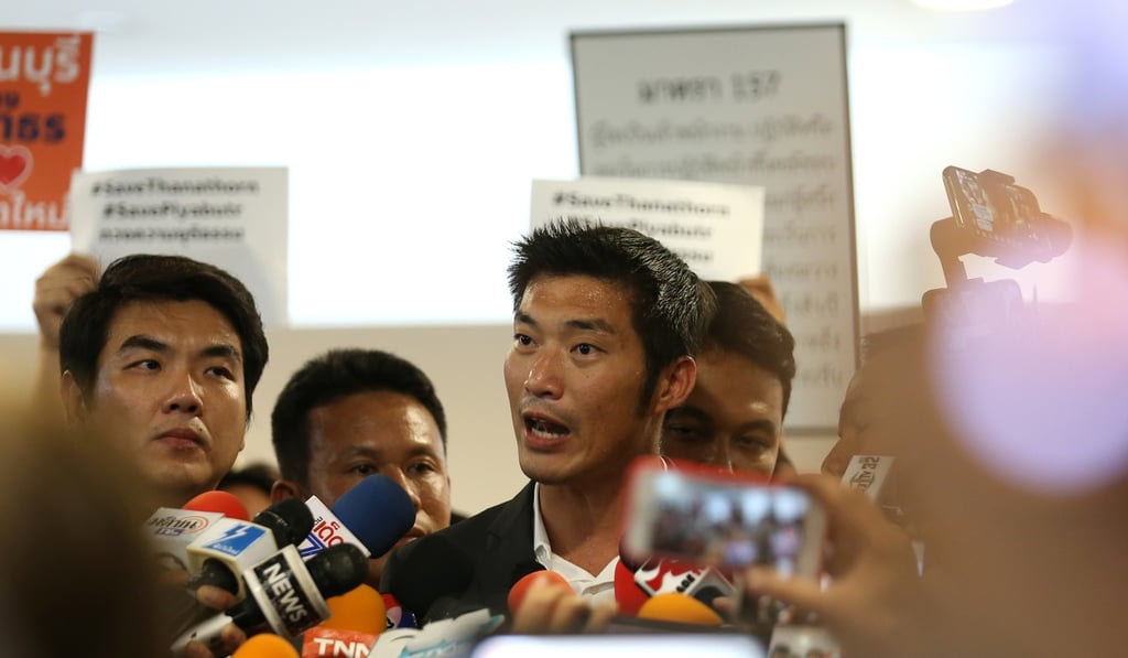 Thai Future Forward Party co-founder and leader Thanathorn Juangroongruangkit (right) stands next to party secretary-general Piyabutr Saengkanokkul. Photo: EPA