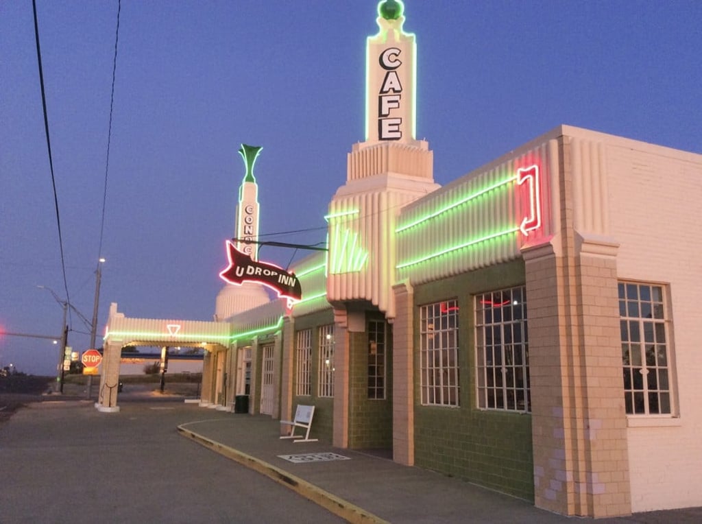 The U-Drop Inn, in Shamrock, Texas, the distinctive architecture of which appears as Ramone’s automotive body and paint shop in 2006 animated movie Cars. Photo: Mark Footer