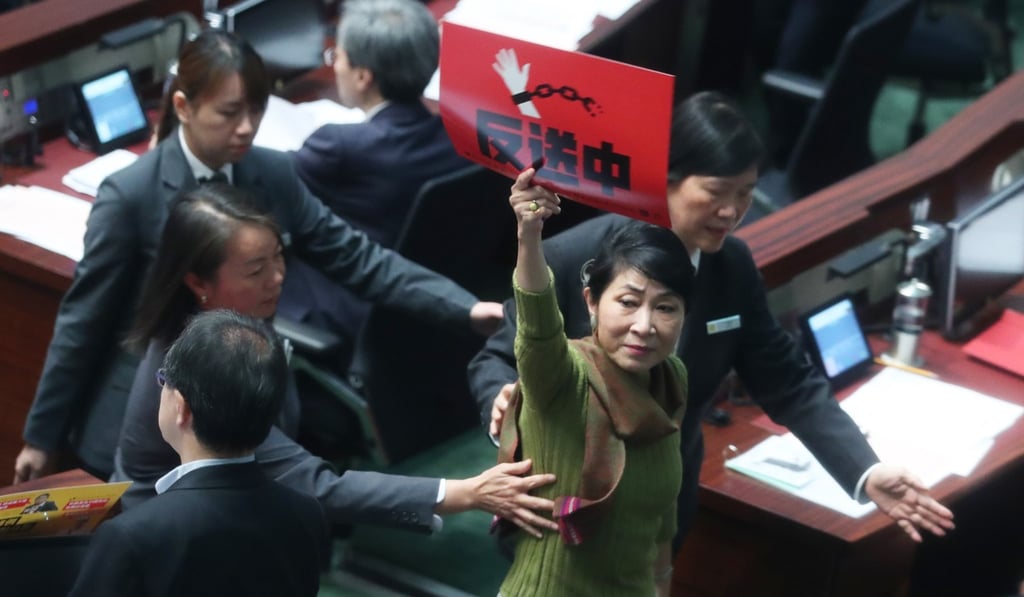 HK First lawmaker Claudia Mo is ejected from the chamber after calling Chief Executive Carrie Lam a liar. Photo: Sam Tsang