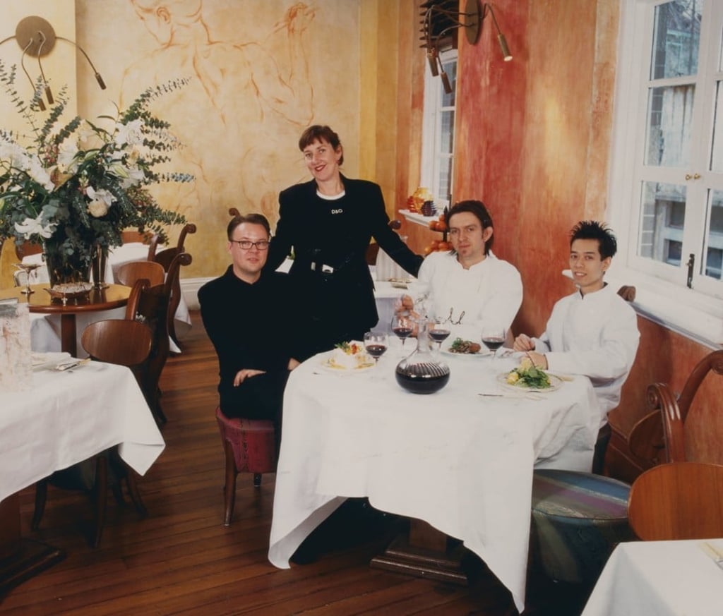 Michelle Garnaut (standing) with some of her restaurant staff in an undated photograph.