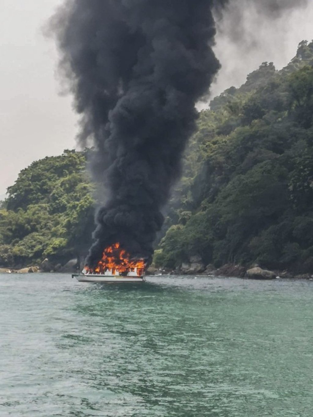The yacht on fire near Mount Davis. Photo: Facebook