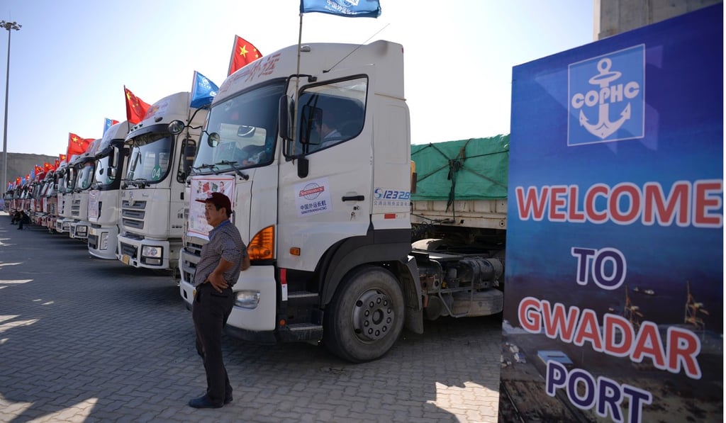 A man stands by Chinese trucks parked at the Gwadar port. Photo: AFP