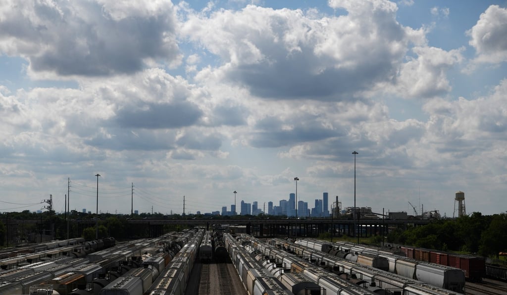 The Houston skyline is seen beyond a railroad yard by the Houston Ship Channel. Photo: Reuters