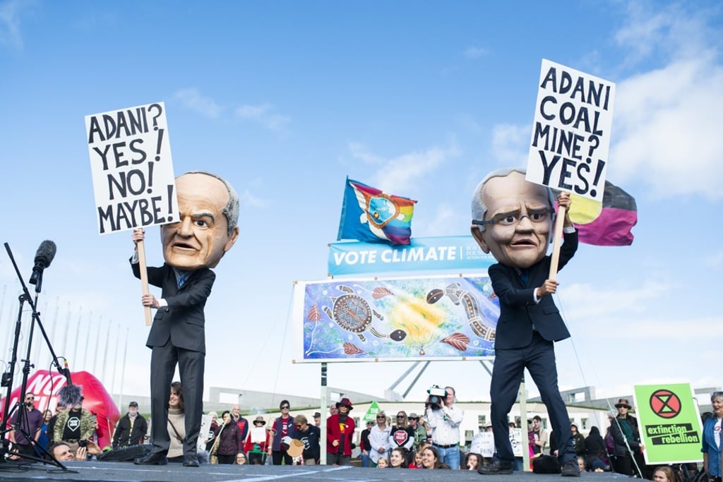Protesters dressed as Scott Morrison and Bill Shorten outside Parliament House in Canberra. Photo: EPA