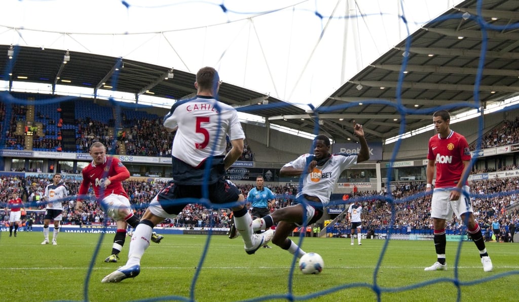 Manchester United’s Wayne Rooney scores against Bolton in 2011. Photo: AP