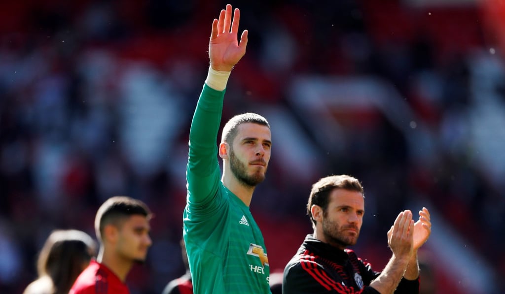 Manchester United's David de Gea and Juan Mata applaud the fans after the final Premier League match.
