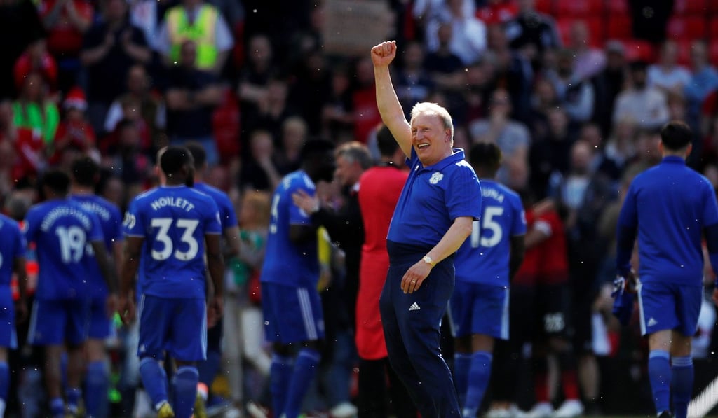 Cardiff City manager Neil Warnock waves to fans after the match.