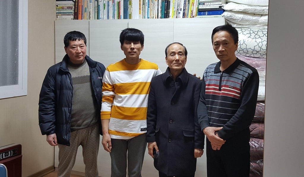 Pastor Lee Sun-gyu (second right) at his centre. Photo: David Lee Pastor Lee Sun-gyu (second right) at his centre. Photo: David Lee