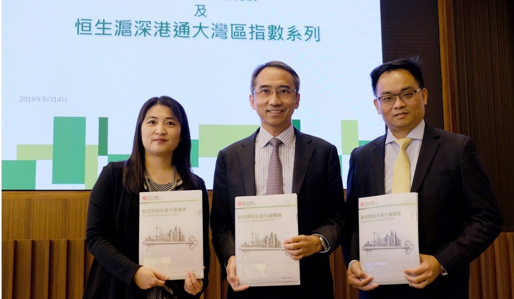 (From left) Anita Mo, director at Hang Seng Indexes; Vincent Kwan Wing-shing, CEO of Hang Seng Indexes; and Daniel Wong, head of research and analytics at Hang Seng Indexes, attend a press conference to launch the new indices, on Tuesday. Photo: Tory Ho